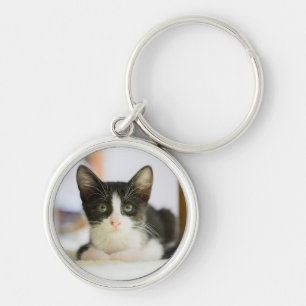 Zoete witte en zwarte keuken sleutelhanger