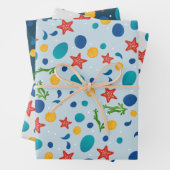 Zomerstrand met zeesterren, schelpen en steentjes inpakpapier vel (In situ)