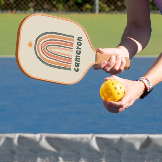 Zon boven een regenboog pickleball paddle (Insitu)