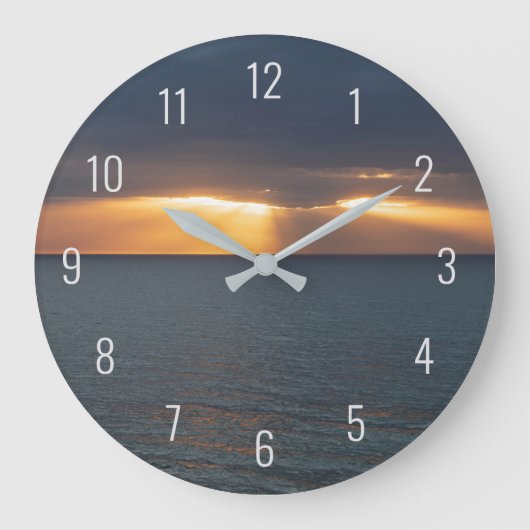 Zon over de oceaan die door de wolken breekt grote klok (Voorkant)