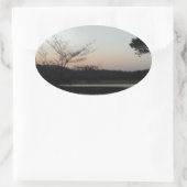 Zon plaatsen, rijzende maan boven Arrowiad Ovale Sticker (Tas)