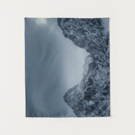 Zonlicht en donkere wolken over sneeuwberggebieden wandkleed