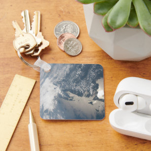 Zonlicht op het water van de aarde. sleutelhanger