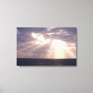 Zonnebeelden door wolken over de oceaan canvas afdruk