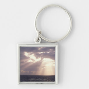 Zonnebeelden door wolken over de oceaan sleutelhanger
