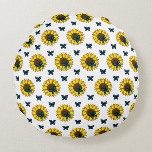 Zonnebloem en blauwe vlinder rond kussen