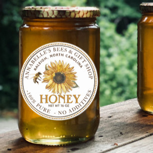 Zonnebloem en honingetiket voor bijen ronde sticker