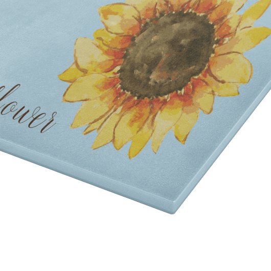 Zonnebloem op blauw snijplank (Hoek)