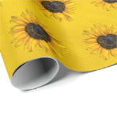 Zonnebloem van het hart op blauw en geel cadeaupapier (Rol Hoek)