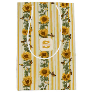 Zonnebloemen en vlinders op gele strepen medium cadeauzakje