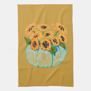 zonnebloemen in de keukenhanddoek met blauw pompoe