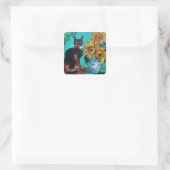 ZONNEN MET ZWARTE KAT IN BLAUWE TURQUOÏE VIERKANTE STICKER (Tas)