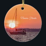 Zonneoporamentornament Keramisch Ornament<br><div class="desc">Versiering - De zon poppen in het midden van een zeilboot langs Santa Rosa Sound in Navarre Florida, Verenigde Staten. De hemel vult met oranje en koraalkleuren, zoals dit bekend staat als het gouden magische uur of het gouden uur. Op zoek naar meer prints of producten? Je kunt mijn winkel...</div>