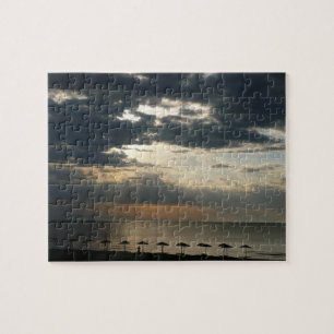 Zonneoppas over het strand in Griekenland - Schild Legpuzzel