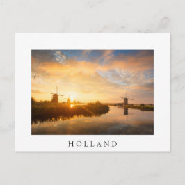 Zonneopstand boven windmolens en een rivier in Ned Briefkaart