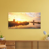 Zonneopstand boven windmolens en een rivier in Ned Canvas Afdruk (Insitu (Woonkamer))
