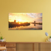 Zonneopstand boven windmolens en een rivier in Ned Canvas Afdruk (Insitu (Woonkamer))