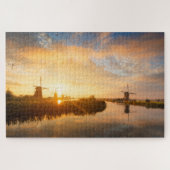 Zonneopstand boven windmolens en een rivier in Ned Legpuzzel (Horizontaal)