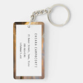 Zonneopstand boven windmolens en een rivier in Ned Sleutelhanger (achterkant)