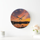 Zonnereflectie en zandkraansilhouet grote klok (Huis)