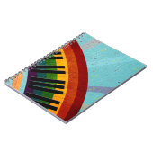 zonneschijn op waterreflecties rond piano notitieboek (Linkerzijde)