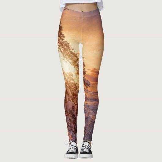 Zonnesten boven zee en snowpiene leggings (Voorkant)