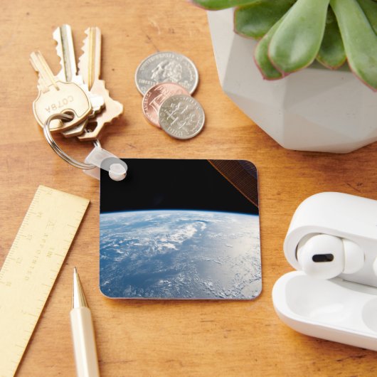 zonnestraal voor de kust van de stille oceaan sleutelhanger (Bureau)