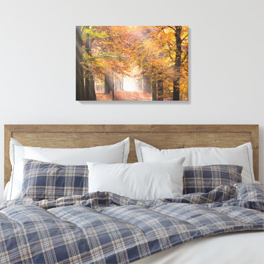 Zonnestralen in een herfst bos canvas (Insitu (Slaapkamer))