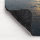 Zonnige stralen van een deels bewolkt zuiden van d muismat (Hoek)