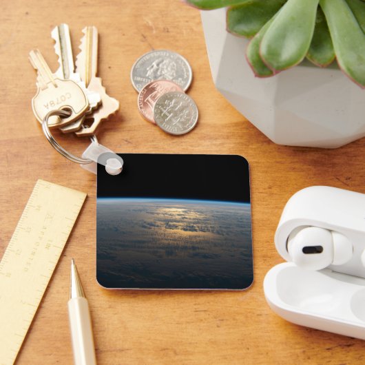 Zonnige stralen van een deels bewolkt zuiden van d sleutelhanger (Bureau)