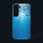 Zonovergoten koraalrif stoere telefoonhoes samsung galaxy hoesje<br><div class="desc">Duik in de adembenemende schoonheid van een zonovergoten onderwaterwereld elke keer dat je je telefoon opneemt. Deze prachtige telefoonhoes heeft een levendig afbeelding van schitterende zonnestralen die door helder blauw water steken en een bloeiend koraalrif vol kleurrijke vissen verlichten. Het unieke uitzicht naar boven met een glimp van bomen creëer...</div>