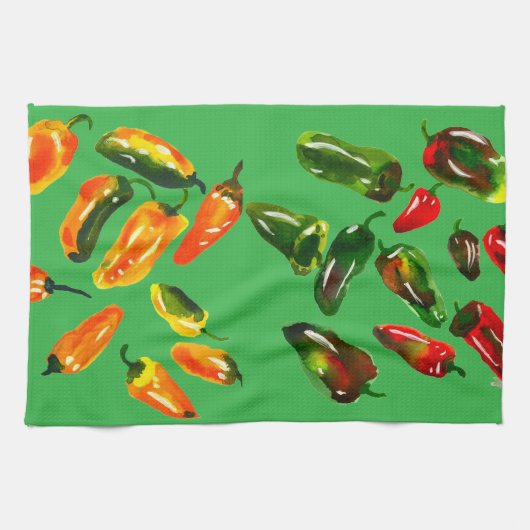 Zonovergoten paprika's op een felgroene keukendoek theedoek (Horizontaal)