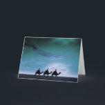 Zonsondergang 3 van drie Koningen Feestdagen Kaart<br><div class="desc">Een mooie Kerstkaart die de drie koningen op kamelen afschilderen,  die door de woestijn tegen een dramatische hemel in koude blauw reizen en cyaan.</div>