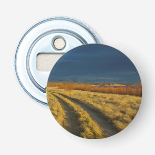 Zonsondergang accentueert de rode bast van struike button flesopener