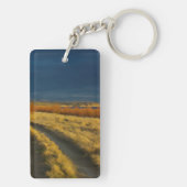 Zonsondergang accentueert de rode bast van struike sleutelhanger (achterkant)
