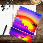 Zonsondergang boven water planner