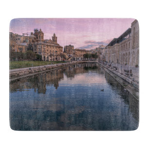 Zonsondergang over klein kanaal in Cospicua, Malta Snijplank