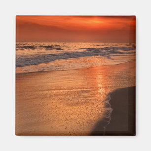 Zonsondergang reflecties van wolken en oceaankust magneet