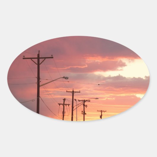 Zonsondergangen in de stad ovale sticker (Voorkant)