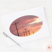 Zonsondergangen in de stad ovale sticker (Envelop)