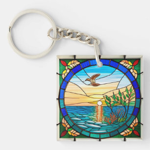 Zonsopgang boven de oceaan met vliegende vogel sleutelhanger