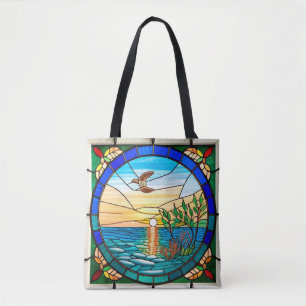 Zonsopgang boven de oceaan met vliegende vogel tote bag