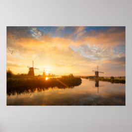 Zonsopgang boven windmolens en een rivier in Holla Poster