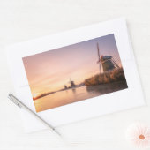 Zonsopkomst over bevroren rivier met windmolens en rechthoekige sticker (Envelop)