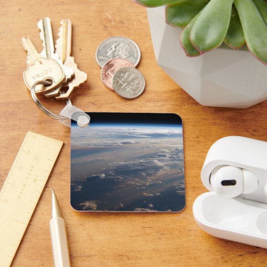 Zonsopkomst werpt lange schaduw over Filipijns Zee Sleutelhanger (Bureau)