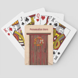 Zuidwest-Chili krans op robuuste rode houten deur Pokerkaarten