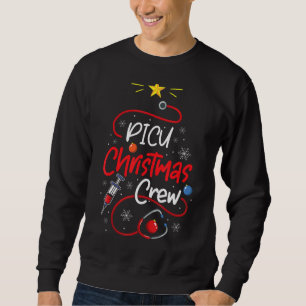 Zuster PICU-kerstpersoneel met kerstverlichting di Trui