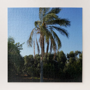 Zwaaiende palmboom onder een heldere hemel legpuzzel
