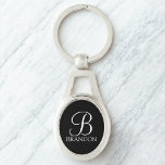 Zwart, aangepast script monogram en naam sleutelhanger<br><div class="desc">De gepersonaliseerde eigenschappen van het Monogram en van de Gift van de Naam personaliseerde monogram in de witte klassieke stijl van de manuscriptdoopvont en naam in de witte klassieke stijl van de serif doopvont op zwarte achtergrond. Ideaal voor vakantie,  gezinshereniging en voor speciale gelegenheden.</div>