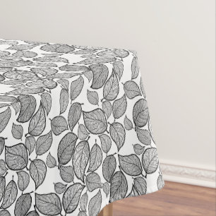 Zwart blad op wit tafelkleed tafelkleed